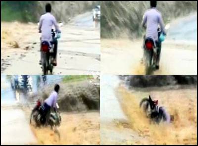 Biker washed away by flood water