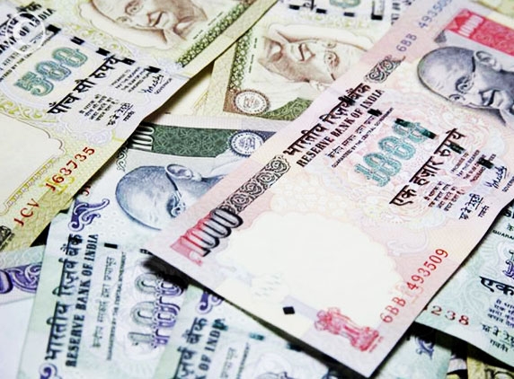 Rupee off highs on oil payment, choppy shares