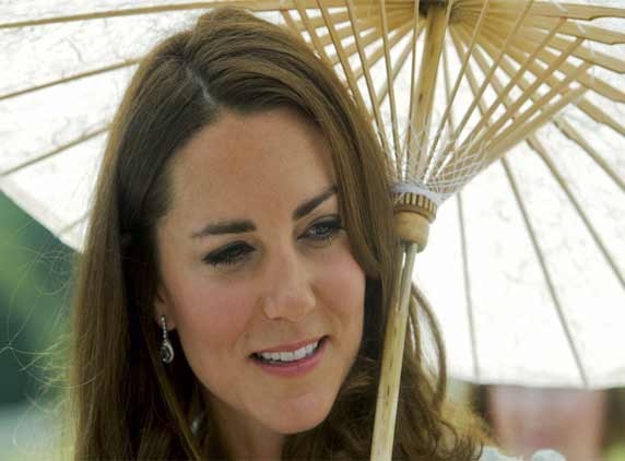 William and Kate unhappy with topless photos 