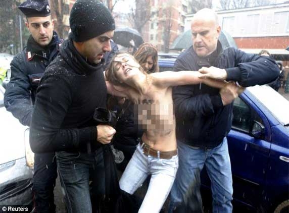 Berlusconi faces topless protests