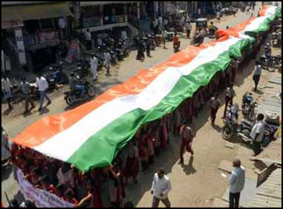 Maidukur Students carrying National Flag