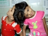 undivided twins Veena and Vani, Siamese twins, veena vani continue to be looked after by hospital, Twins