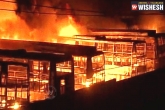 agitation, Bengaluru, 56 kpn travels buses worth rs 50 crore burnt in bengaluru, Travels