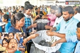 Fish Prasadam, Fish Prasadam updates, thousands take fish prasadam in hyderabad, Nampally grounds