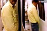 Viral videos, Viral videos, watch man pees in metro coach, Delhi train
