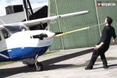 weird news, Man pulls an aeroplane with ears, man pulls an aeroplane with ears, Aeroplane