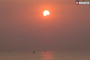 Total solar eclipse: People watch moon blocking sun in Indonesia