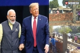 Municipal Corporation of Ahmedabad, Municipal Corporation of Ahmedabad, trump roadshow govt building a wall to cover slums, Ahmedabad