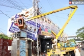 GHMC officials, illegal hoardings Hyderabad, 20 000 illegal hoardings removed in hyderabad, Ghmc officials