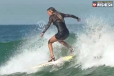 high heels surfing, viral videos, omg girl is surfing with high heels, High heels