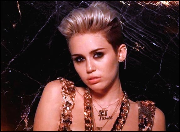 Miley Cyrus gets smoldering hot with 'Fire'