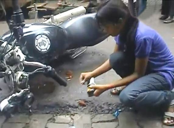 Girl roughs up eve teaser and sets fire to his bike
