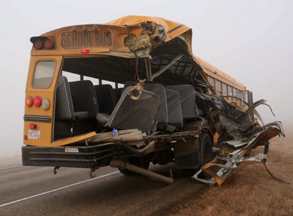 School bus turns turtle, 15 injured