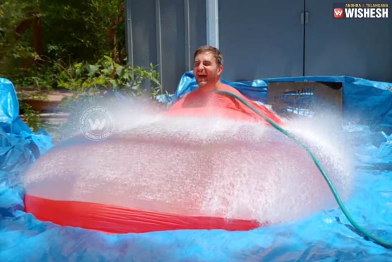 Watch: 6ft. Man in 6ft. Water balloon