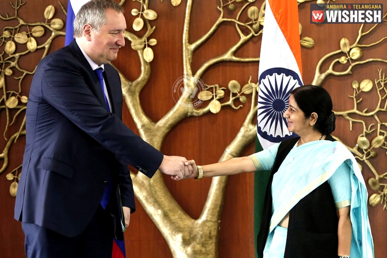 Sushma meets Brics, holds trilateral with Japan and US