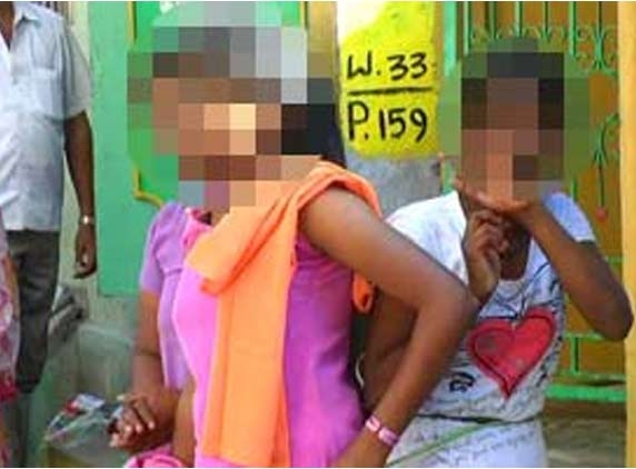 Teenage girls tied to lamp post and beat