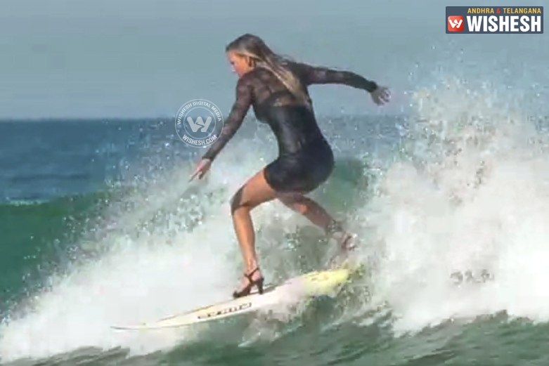 OMG! Girl is surfing with high heels